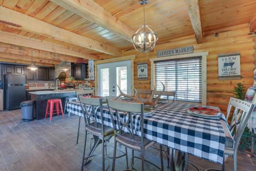 a kitchen and dining room with a table and chairs at Secluded Mountain Getaway in Wyoming Range! in Kemmerer