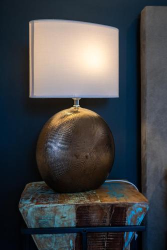 a lamp sitting on top of a table at Apartment Sladic in Sisak