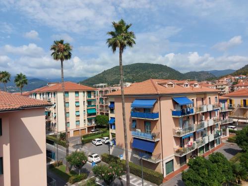 an aerial view of buildings in a city with palm trees at Relax al mare in Borgio Verezzi