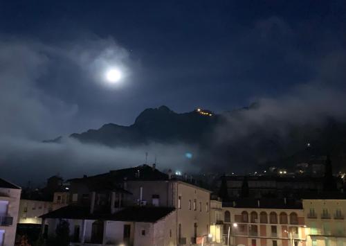 a view of a mountain at night with the moon at El Segon Pis in Berga