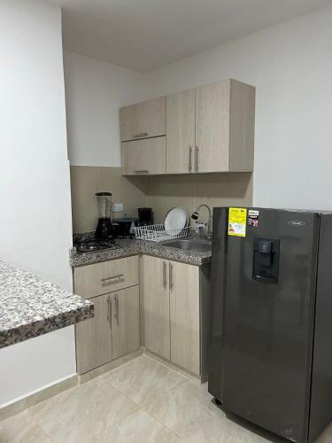 Η κουζίνα ή μικρή κουζίνα στο Moderno Edifico en el sur de Cali