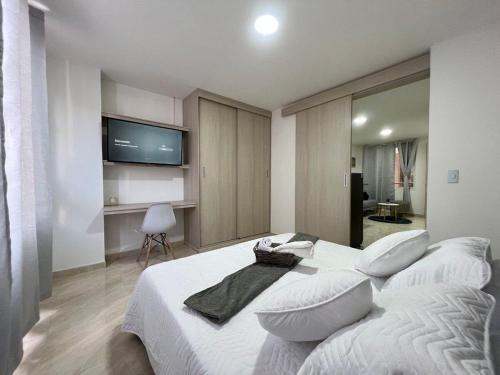 Ένα ή περισσότερα κρεβάτια σε δωμάτιο στο Moderno Edifico en el sur de Cali