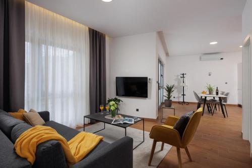 TV a/nebo společenská místnost v ubytování TERRA 5 DELUXE Apartment on the ground floor with private parking