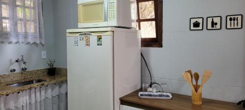 Køkken eller tekøkken på Hospedagem Doce Lar Casa Violeta