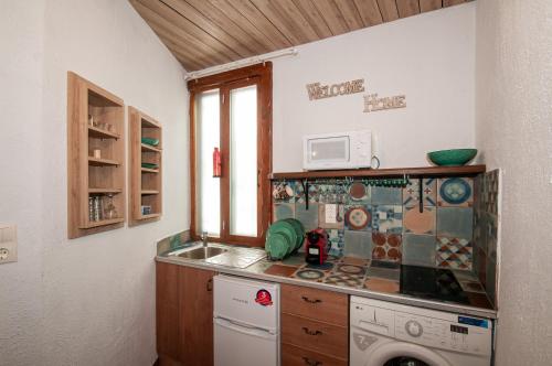 Tango Suites tesisinde mutfak veya mini mutfak