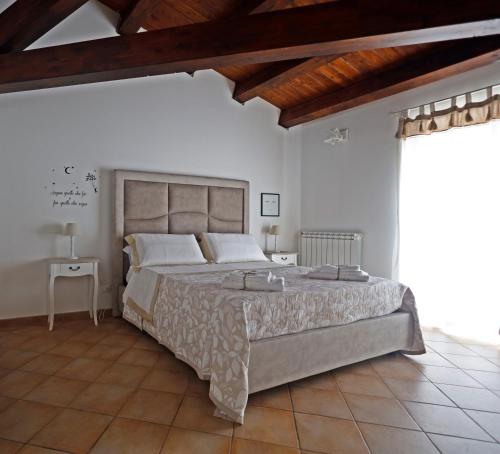 a bedroom with a large bed in a room at La Casa di Filippo in Palermo