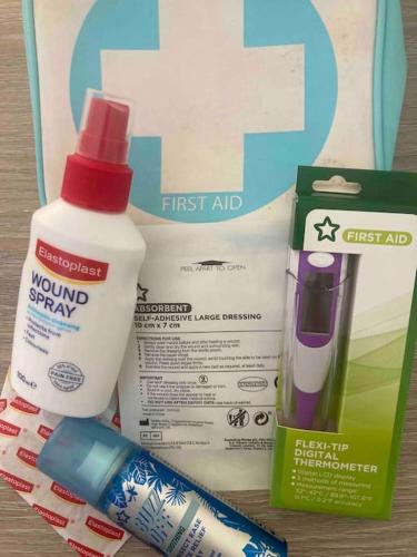 a box with a bottle of mouthwash and a toothbrush at Spacious Semi-detached Southsea House, Free Parking On Drive in Portsmouth