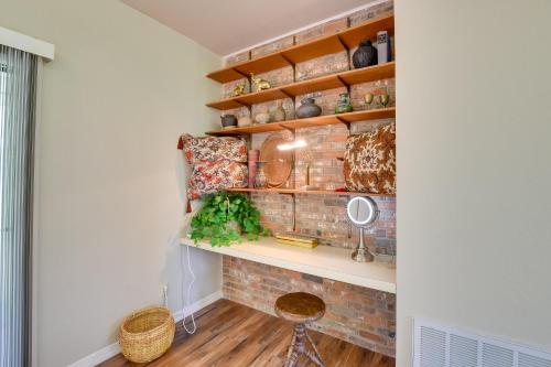 a room with a brick wall and a shelf at Serene Buffalo Gap Oasis on 4 Secluded Acres! in Abilene