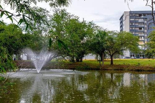 a fountain in the middle of a pond at Premium space in Santiago- 5 Min Away from airport in Santiago de los Caballeros