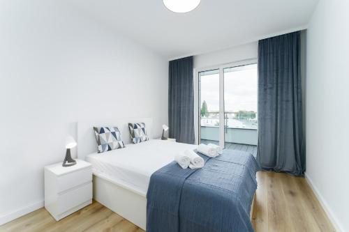 Postel nebo postele na pokoji v ubytování Apartament Morski Navigator by HolidaySun