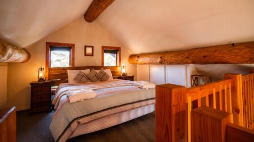 a bedroom with a large bed in a attic at Cascade Creek Retreat in Milton