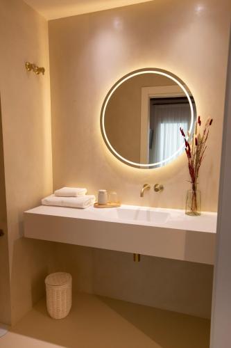 a bathroom with a sink and a mirror at Alux Boutique Hotel in Málaga