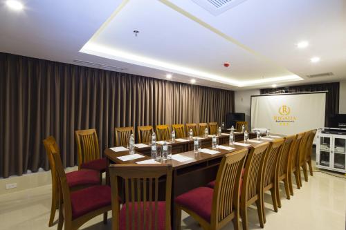 a conference room with a long table and chairs at Regalia Nha Trang in Nha Trang