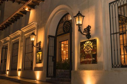a building with lights on the side of it at Hotel Plaza 79 in San Cristóbal de Las Casas