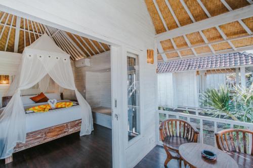 Postel nebo postele na pokoji v ubytování Paluh Beach Huts