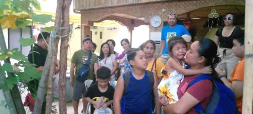 a group of people standing together in a group at Bambooze Hauz in Boracay