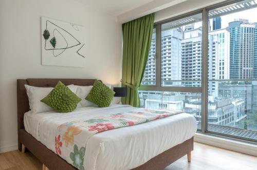 a bedroom with a bed and a large window at B112 l Bukit Bintang l Pavilion l KLCC l MRT in Kuala Lumpur