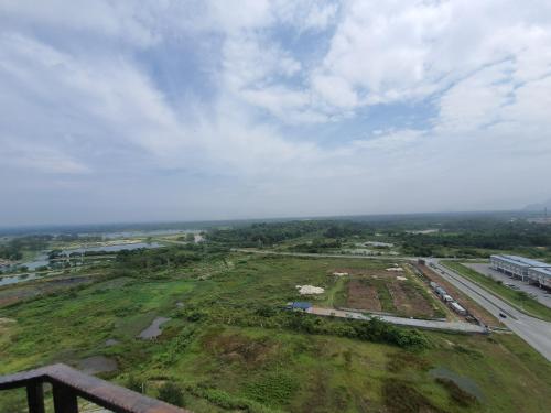 an aerial view of a field and a road at A Modern & Homely Studio with Pool and Gym in Kampar