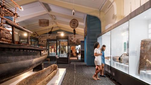 two people looking at exhibits in a museum at Grand Pacific Hotel in Suva