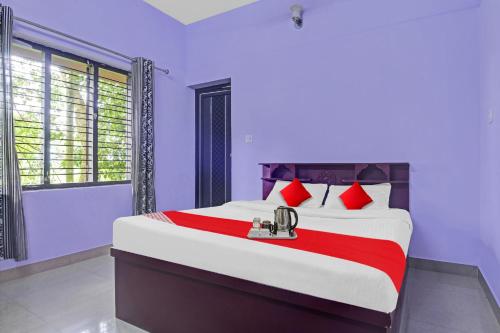 Postel nebo postele na pokoji v ubytování Collection O Clement Holydays