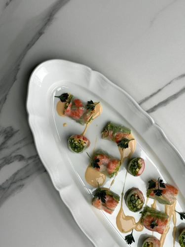 a white plate of food on a table at hotel norm. fuji in Fujikawaguchiko