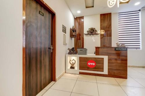 a lobby with a door with a stop sign on it at Super OYO Flagship Hotel Sky Land in Ludhiana