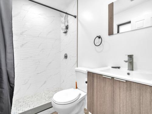 a bathroom with a toilet and a sink and a shower at Upscale 3 Bedroom House in Centric Location - in Miami Shores in Miami