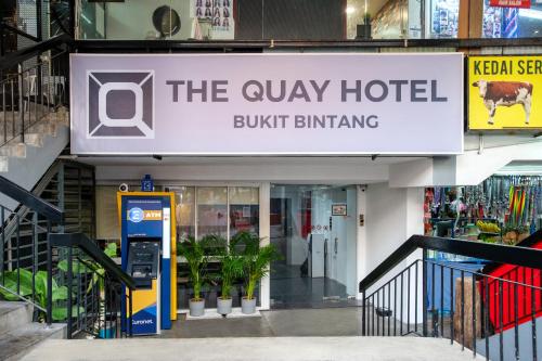 a sign for the quay hotel buff buff buff buff buff buff buffing at The Quay Hotel Bukit Bintang in Kuala Lumpur