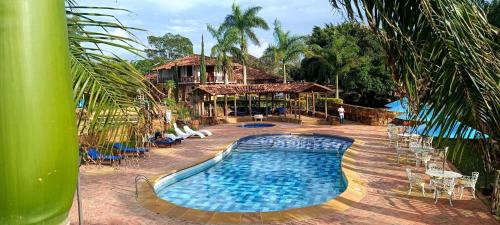 a large swimming pool in front of a resort at Hotel Buenosaires Barichara in Barichara