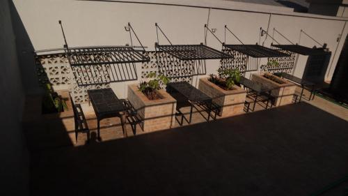 a group of chairs and tables on a balcony at El Hogar near UN Headquarters, Gigiri in Kiambu