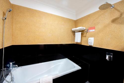 a bathroom with a white sink in a room at Royal Crown Hotel & Spa in Siem Reap
