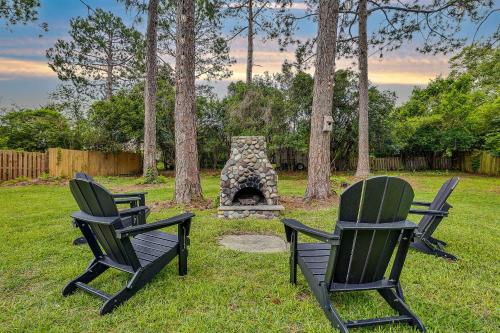 two chairs sitting in front of a stone fireplace at Quiet escape in Wilmington in Wilmington