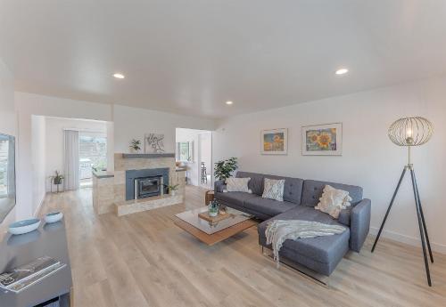 a living room with a couch and a fireplace at 3896 Gather and Rest home in Del Rey Oaks