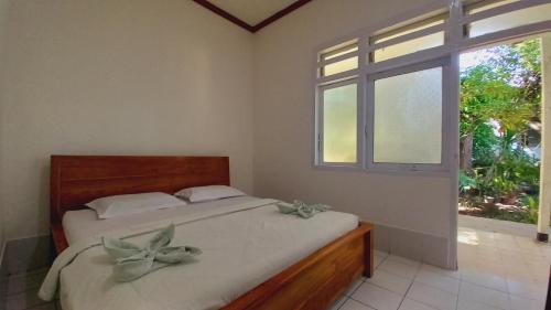 Ένα ή περισσότερα κρεβάτια σε δωμάτιο στο Bajo Hotel