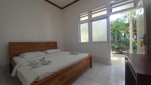 Ένα ή περισσότερα κρεβάτια σε δωμάτιο στο Bajo Hotel