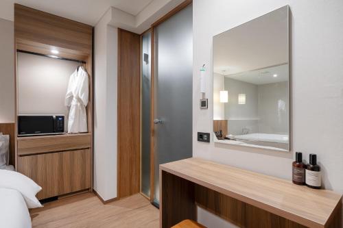TV a/nebo společenská místnost v ubytování Simjak Hotel by Aank