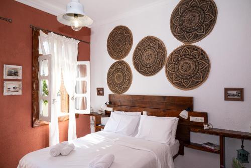 Tango Suites tesisinde bir odada yatak veya yataklar
