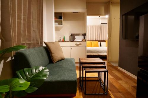 a living room with a couch and a table at Liaison Court Universal Gateway in Osaka
