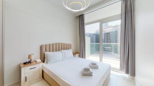 Postel nebo postele na pokoji v ubytování Primestay - Reva Residences 1BR