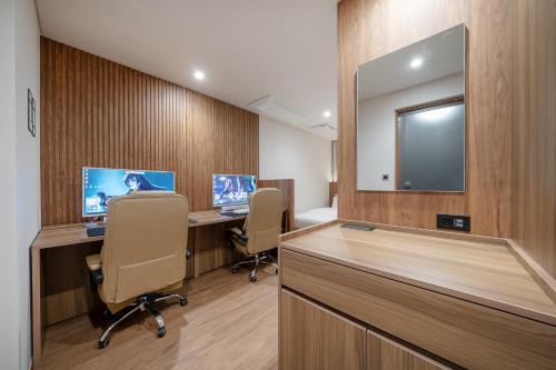 TV a/nebo společenská místnost v ubytování Simjak Hotel by Aank