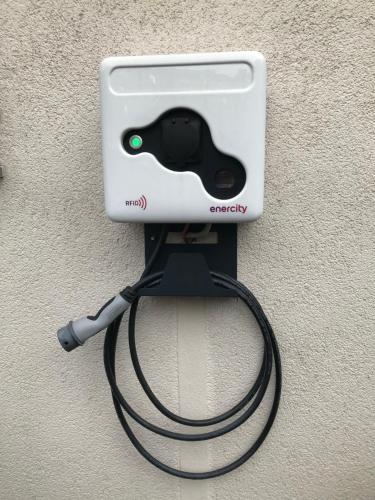 a video game controller hooked up to a charger at Budget by Hotel Savoy Hannover in Hannover