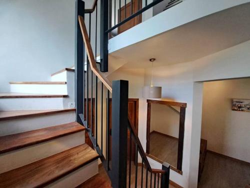 a staircase in a house with wooden floors at Tropical 3-bedrooms Coastal Residence Creolia in Grand Baie