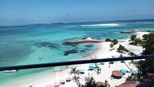 a view of the beach from the balcony of a resort at Kaani Grand Seaview in Maafushi