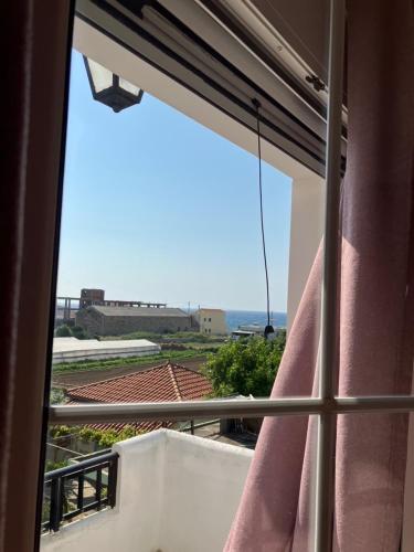 a view from a window of a balcony at VOULA'S HOUSES in Karlovasi