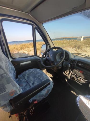 a seat in the back of a vehicle with a steering wheel at Keros Summer Camp in Kalliópi