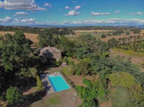 an aerial view of a house with a swimming pool at Collina Blu in Bolsena