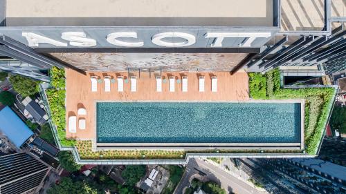 an overhead view of a building with a swimming pool at Ascott Star KLCC Kuala Lumpur in Kuala Lumpur