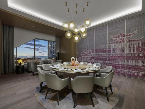 a dining room with a table and chairs at Dhawa Xi'an Chanba in Xi'an