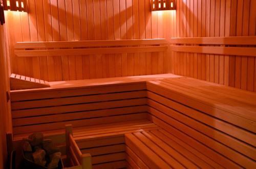 an empty sauna with wood paneling and lights at Adranos Hotel in Bursa