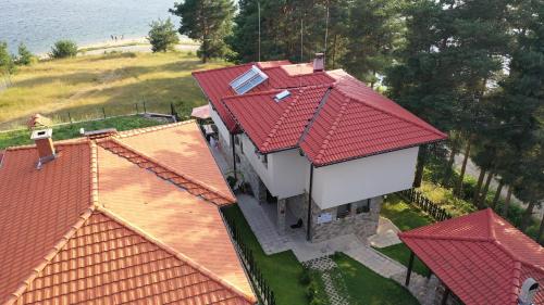 an overhead view of a house with red roofs at Къща за гости СИАНА in Dospat